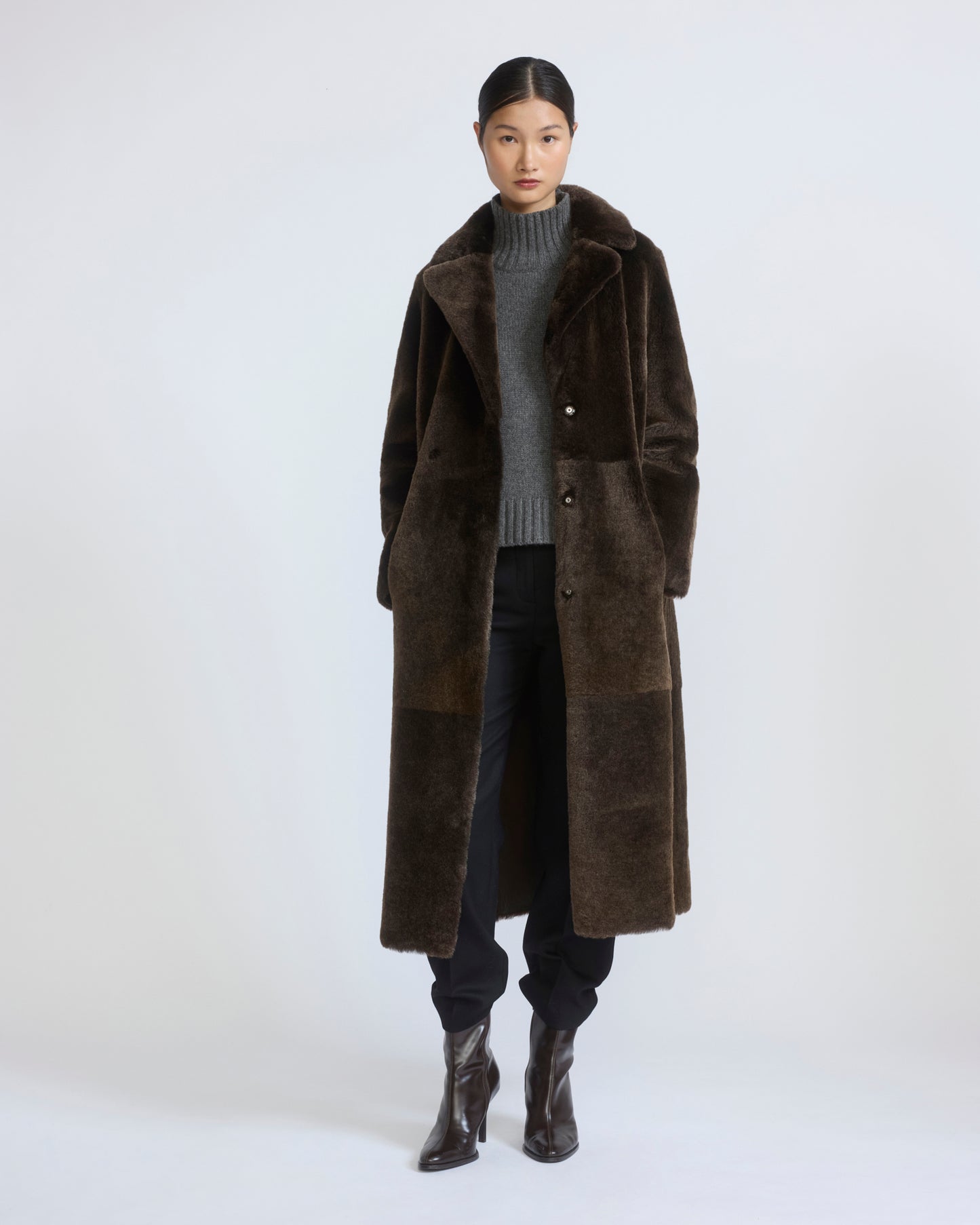 Reversible belted long shearling coat