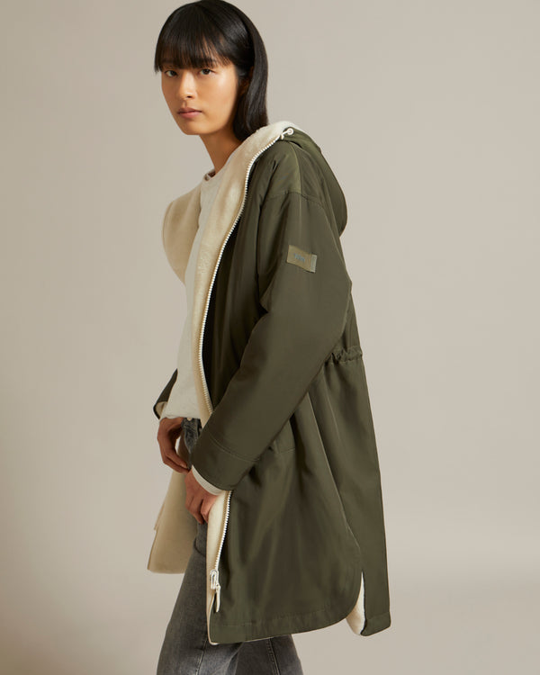 Parka réversible en tissu technique déperlant et peau lainée mérinillo