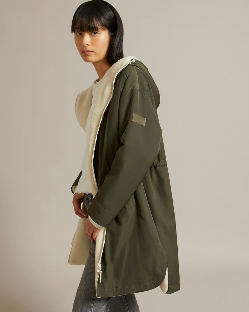 Parka réversible en tissu technique déperlant et peau lainée mérinillo