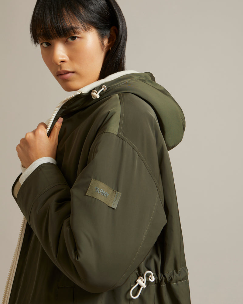 Parka réversible en tissu technique déperlant et peau lainée mérinillo