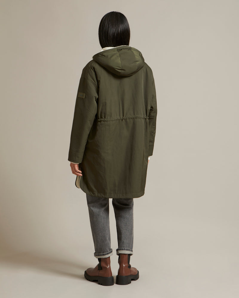 Parka réversible en tissu technique déperlant et peau lainée mérinillo