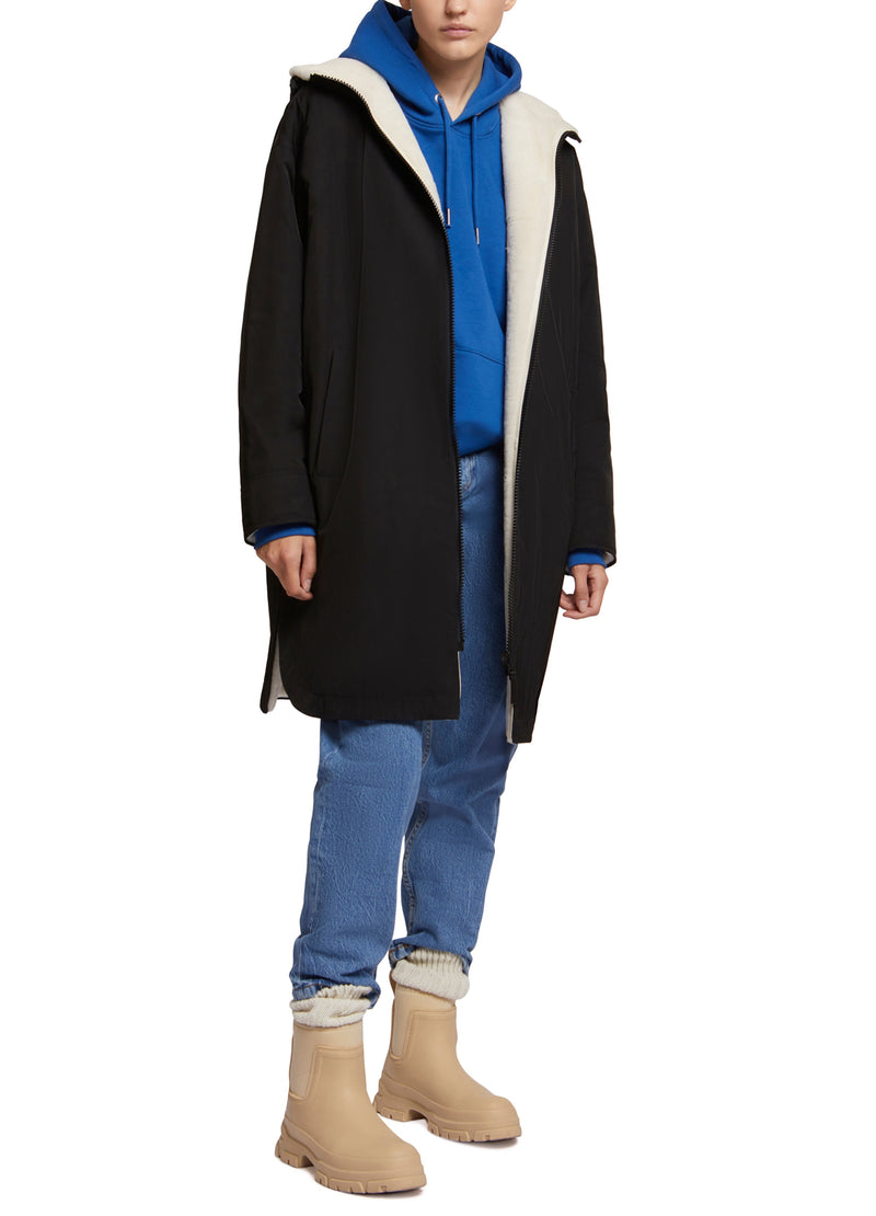 Parka réversible en tissu technique déperlant et peau lainée mérinillo