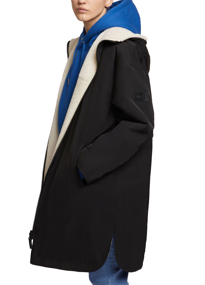 Parka réversible en tissu technique déperlant et peau lainée mérinillo