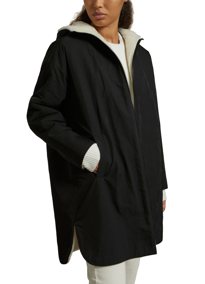 Parka réversible en tissu technique déperlant et peau lainée mérinillo