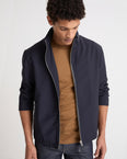 Veste imperméable en jersey avec détails en cuir et capuche