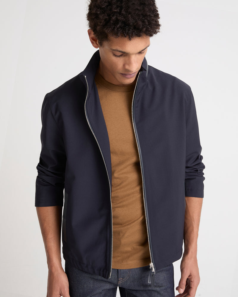 Veste imperméable en jersey avec détails en cuir et capuche