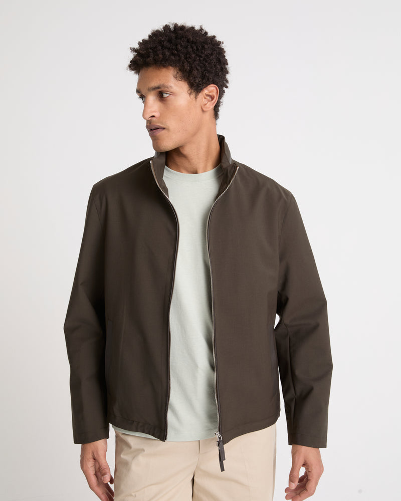 Veste imperméable en jersey avec détails en cuir et capuche