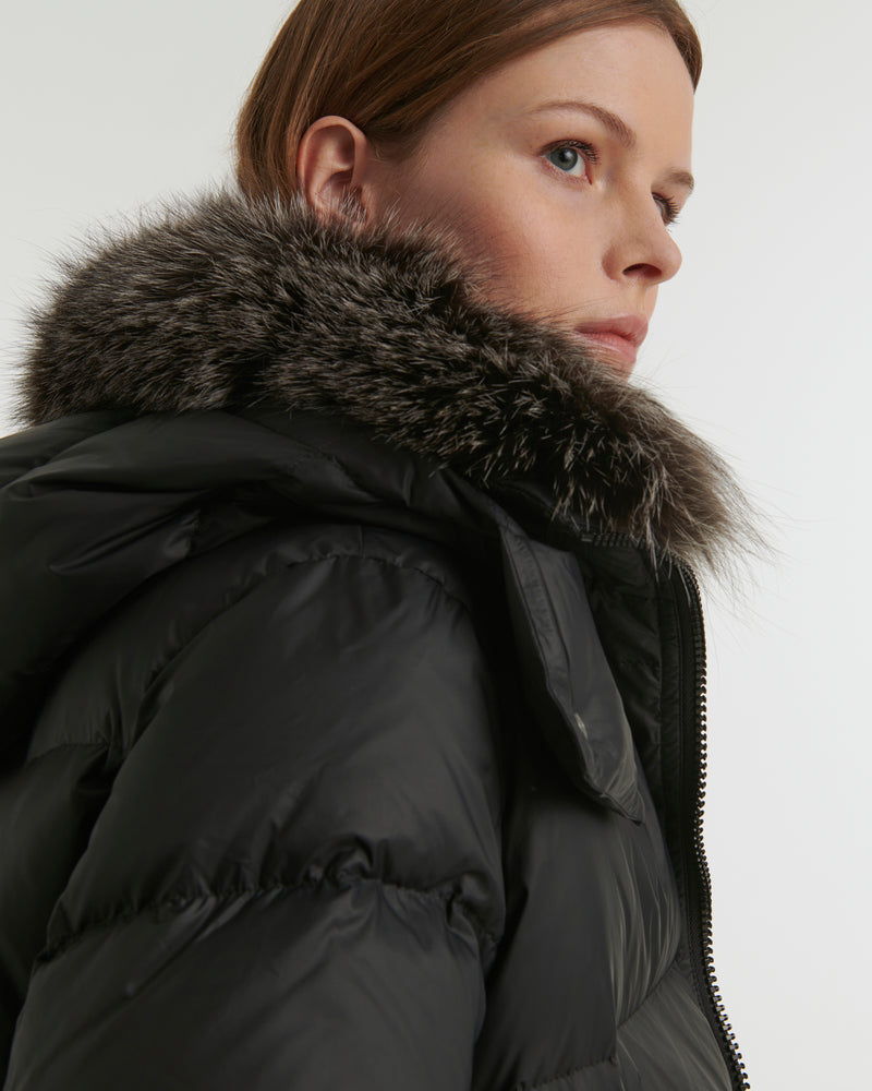 A line down jacket in water-repellent technical fabric with fox fur collar