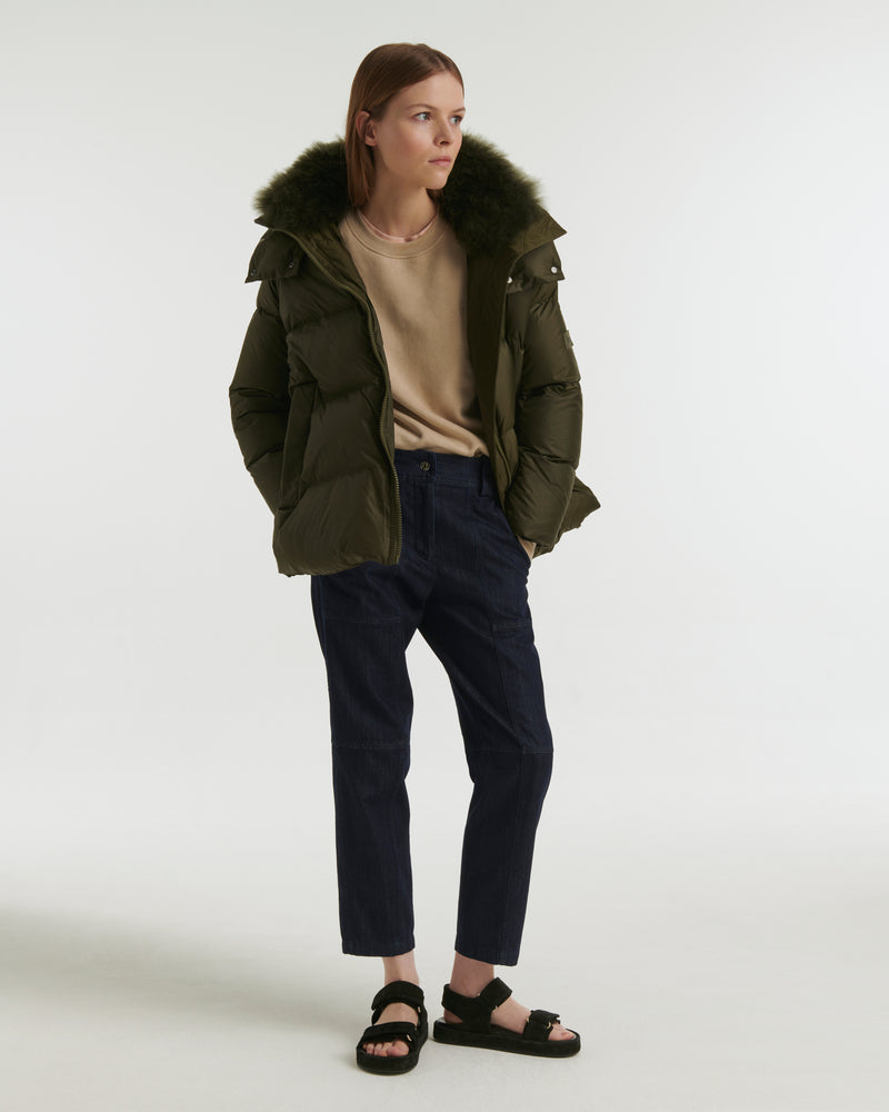 A line down jacket in water-repellent technical fabric with fluffy lambswool collar