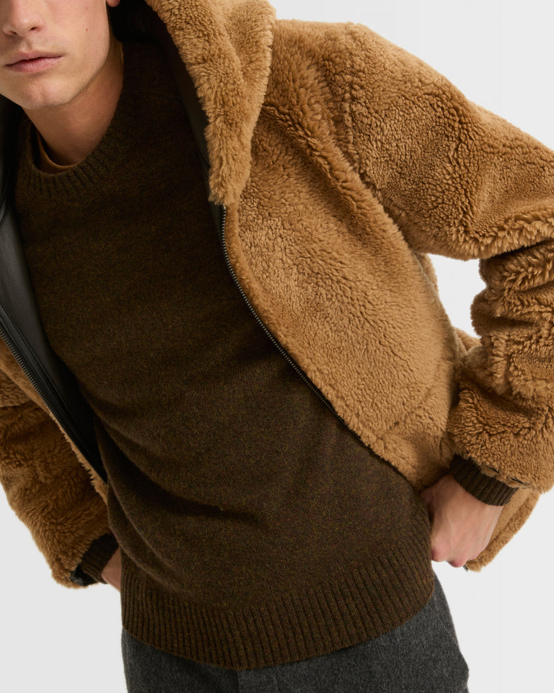 Blouson à capuche en peau lainée réversible