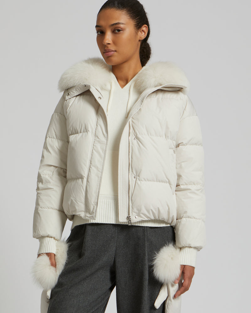 Boxy down jacket in waterproof technical fabric with fox fur collar