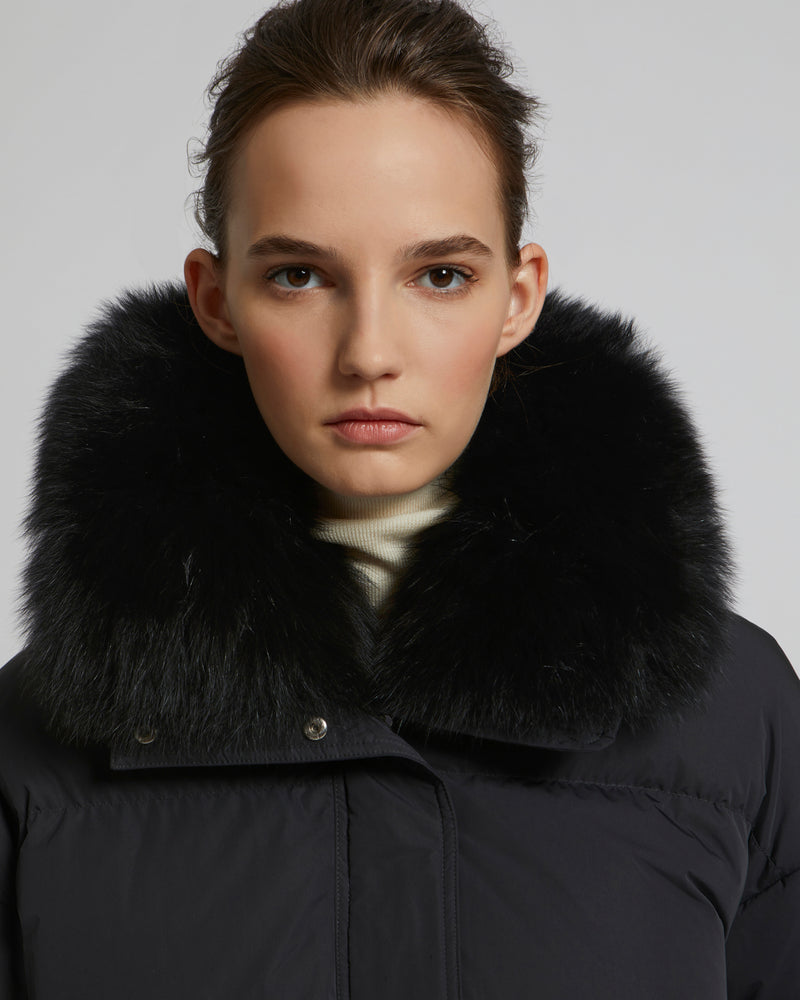 Boxy down jacket in waterproof technical fabric with fox fur collar