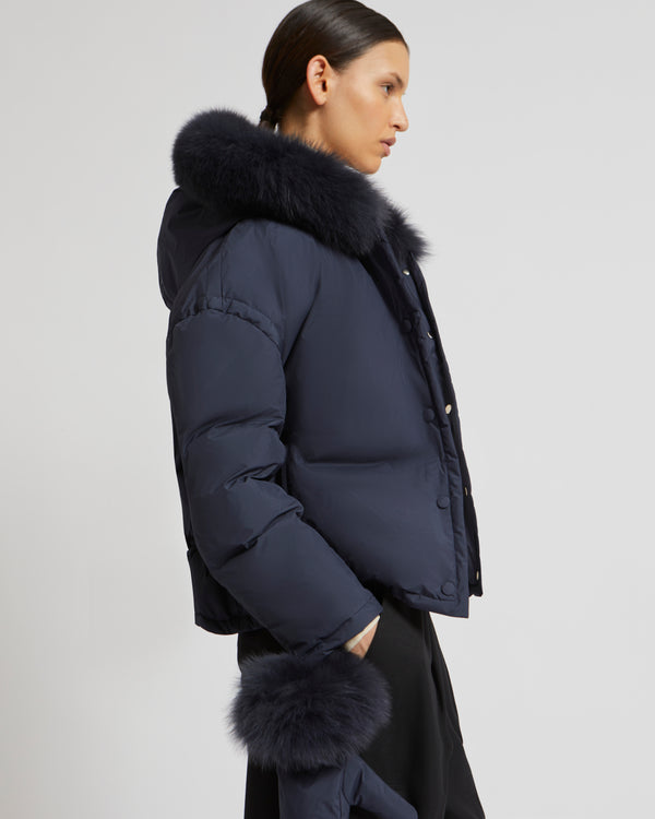Boxy down jacket in waterproof technical fabric with fox hood trim