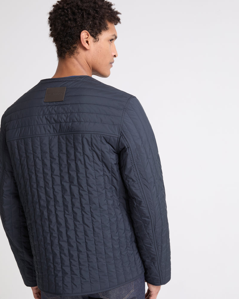 Surchemise matelassée en tissu technique imperméable