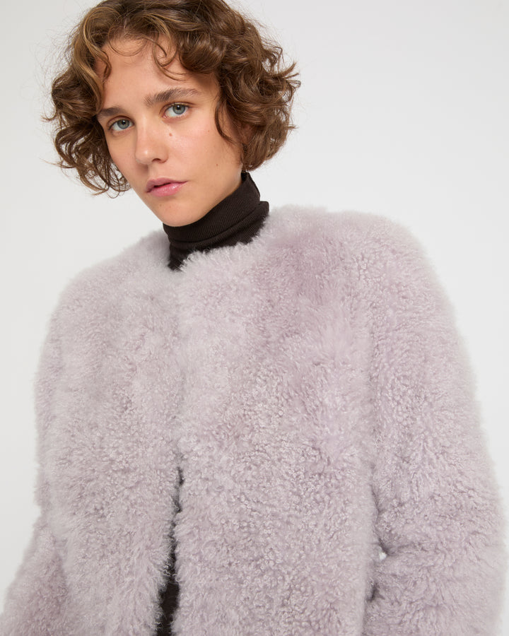 Coat in merino knit and lambskin