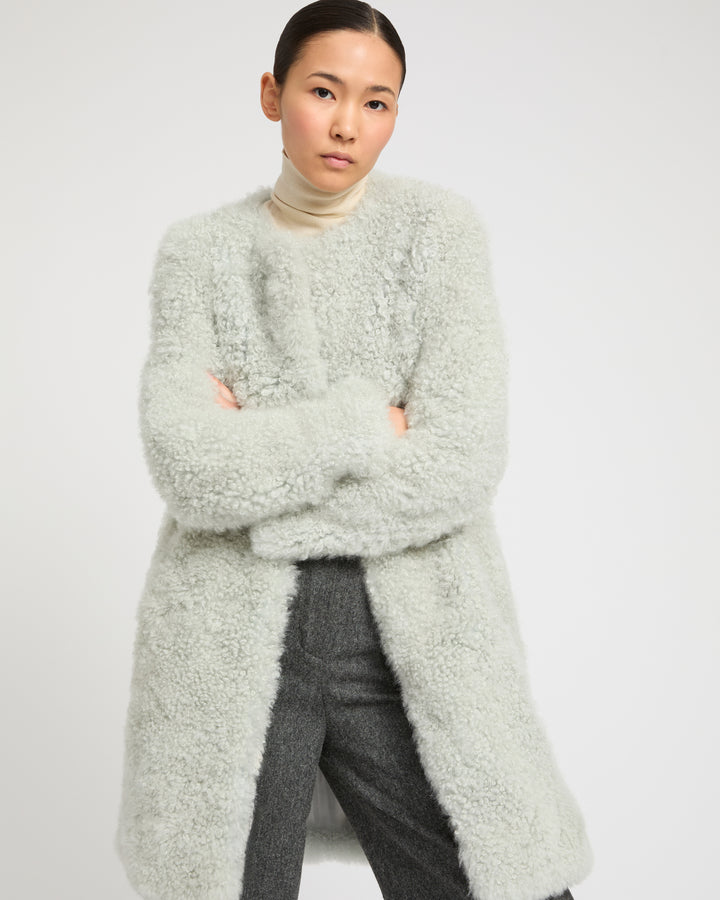 Coat in merino knit and lambskin