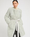 Coat in merino knit and lambskin
