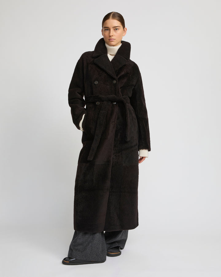 Manteau à double boutonnage en peau lainée agneau façon astrakan