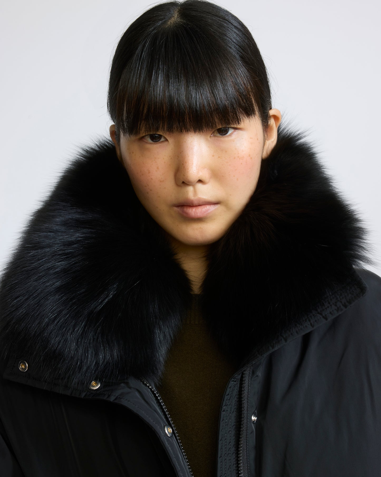 Short technical fabric down jacket with detachable fox fur collar