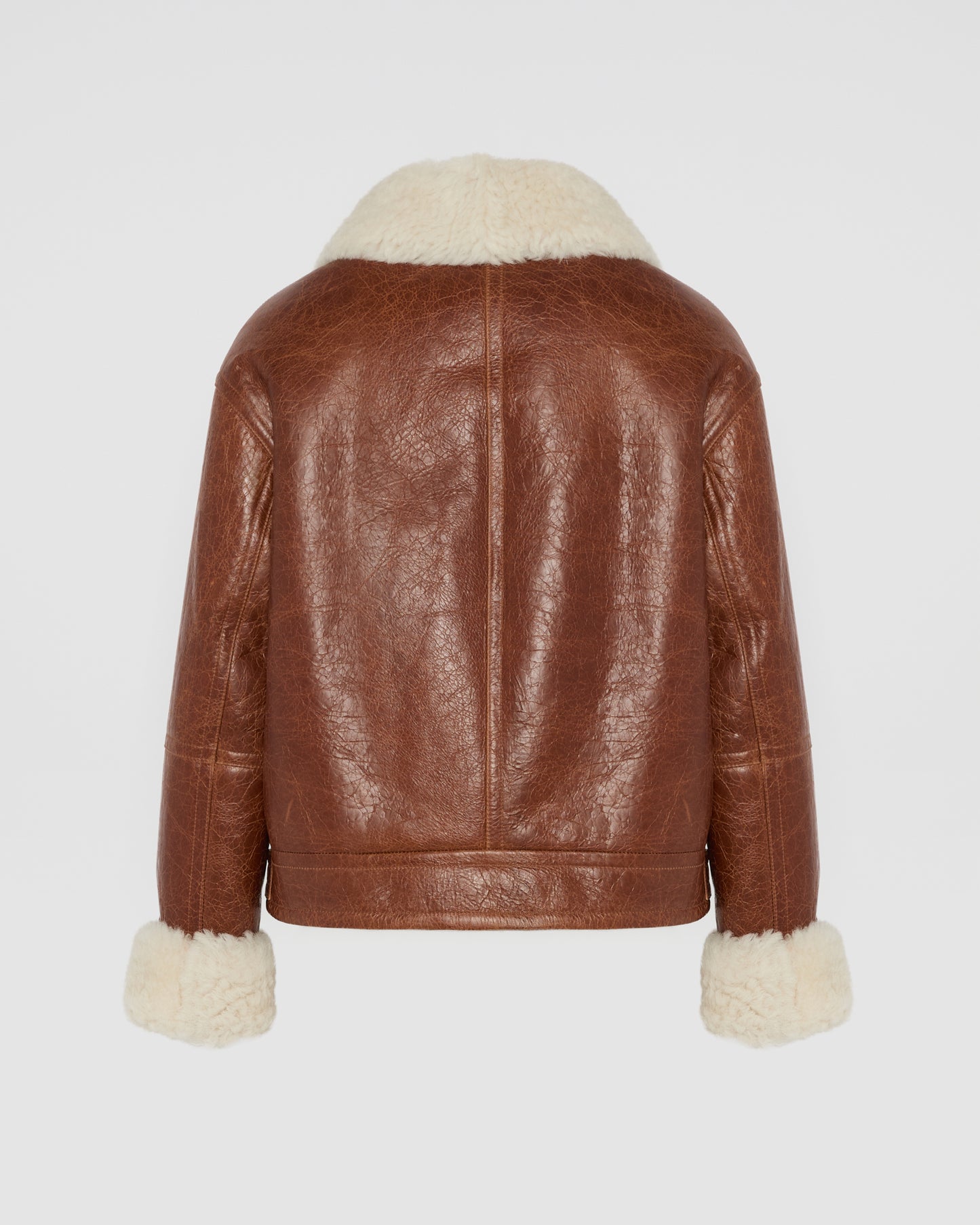 Veste courte en peau lainée d'agneau de Toscane curly avec finition vintage