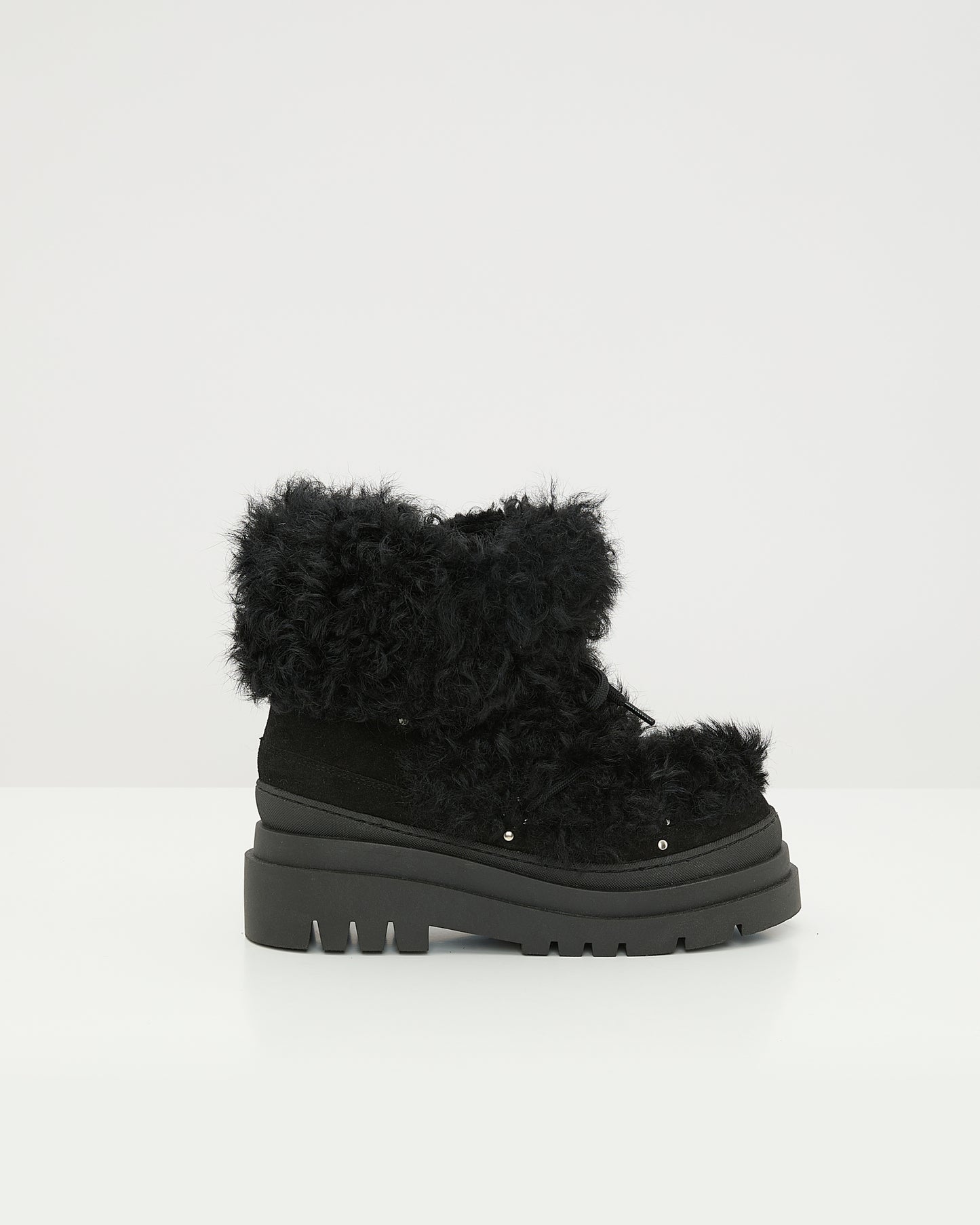 Ankle boots in leather and Lacon shearling