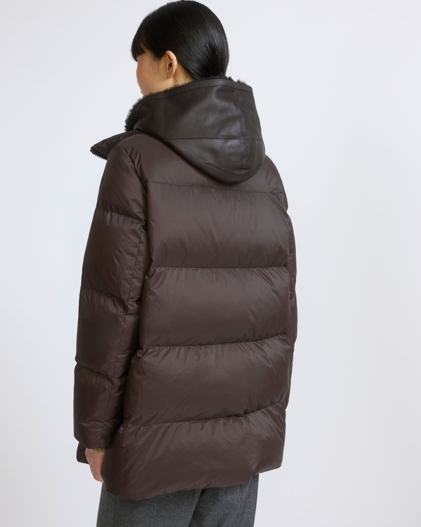 A-line down jacket in waterproof technical fabric with lambskin shearling bib panel