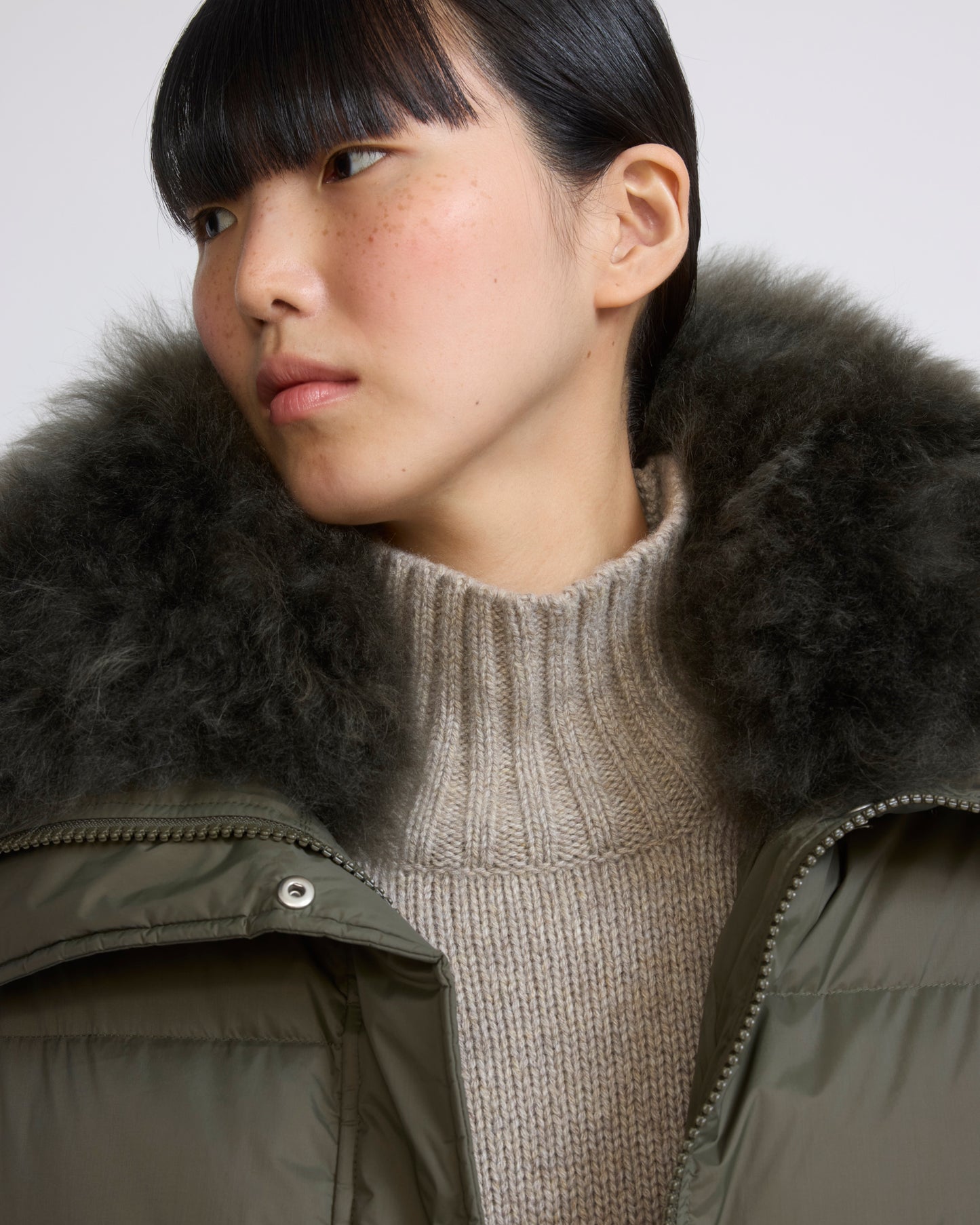 Short down jacket in waterproof technical fabric with airy lambswool trim