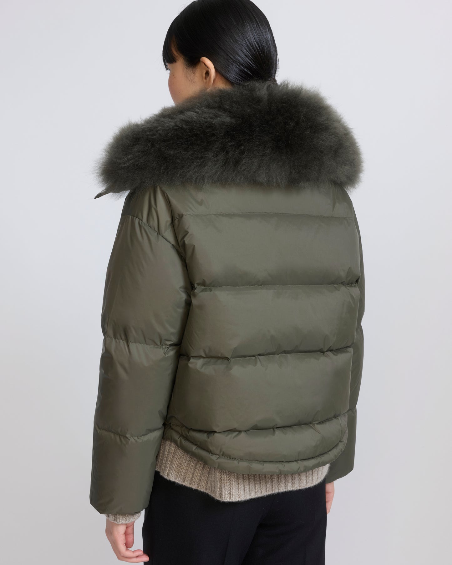 Short down jacket in waterproof technical fabric with airy lambswool trim