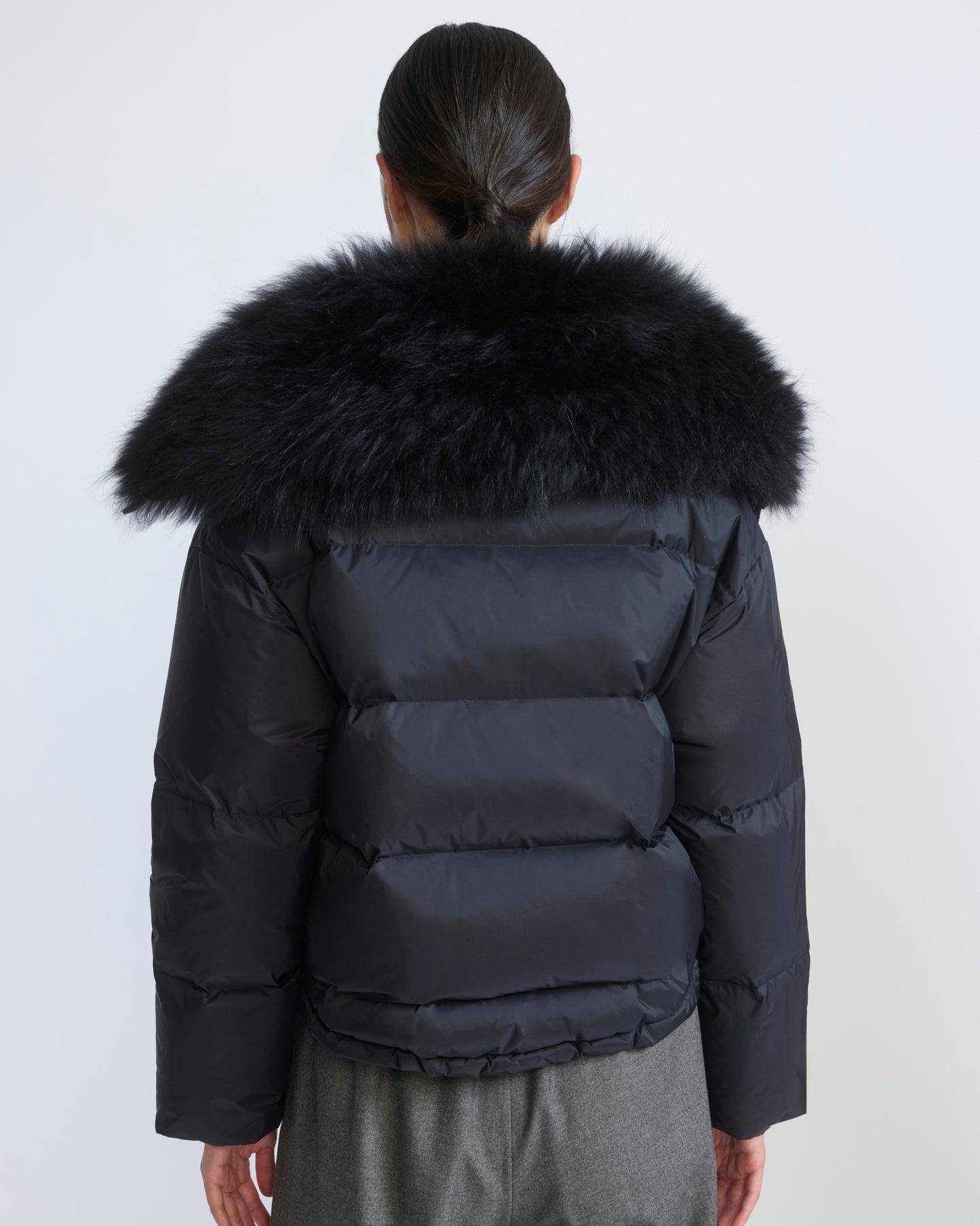 Short down jacket in waterproof technical fabric with airy lambswool trim