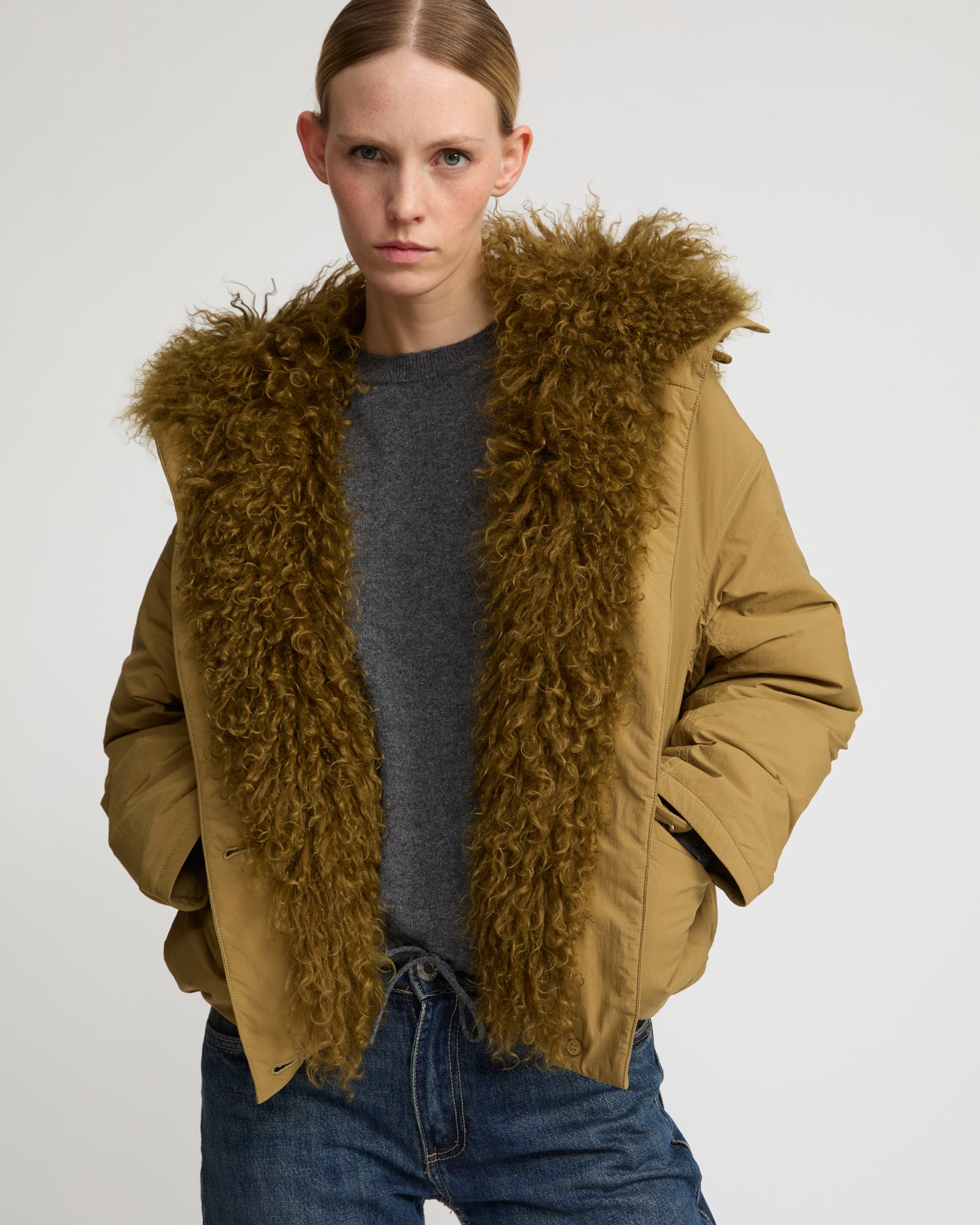 Short ultra-light down jacket with curly lambskin trim