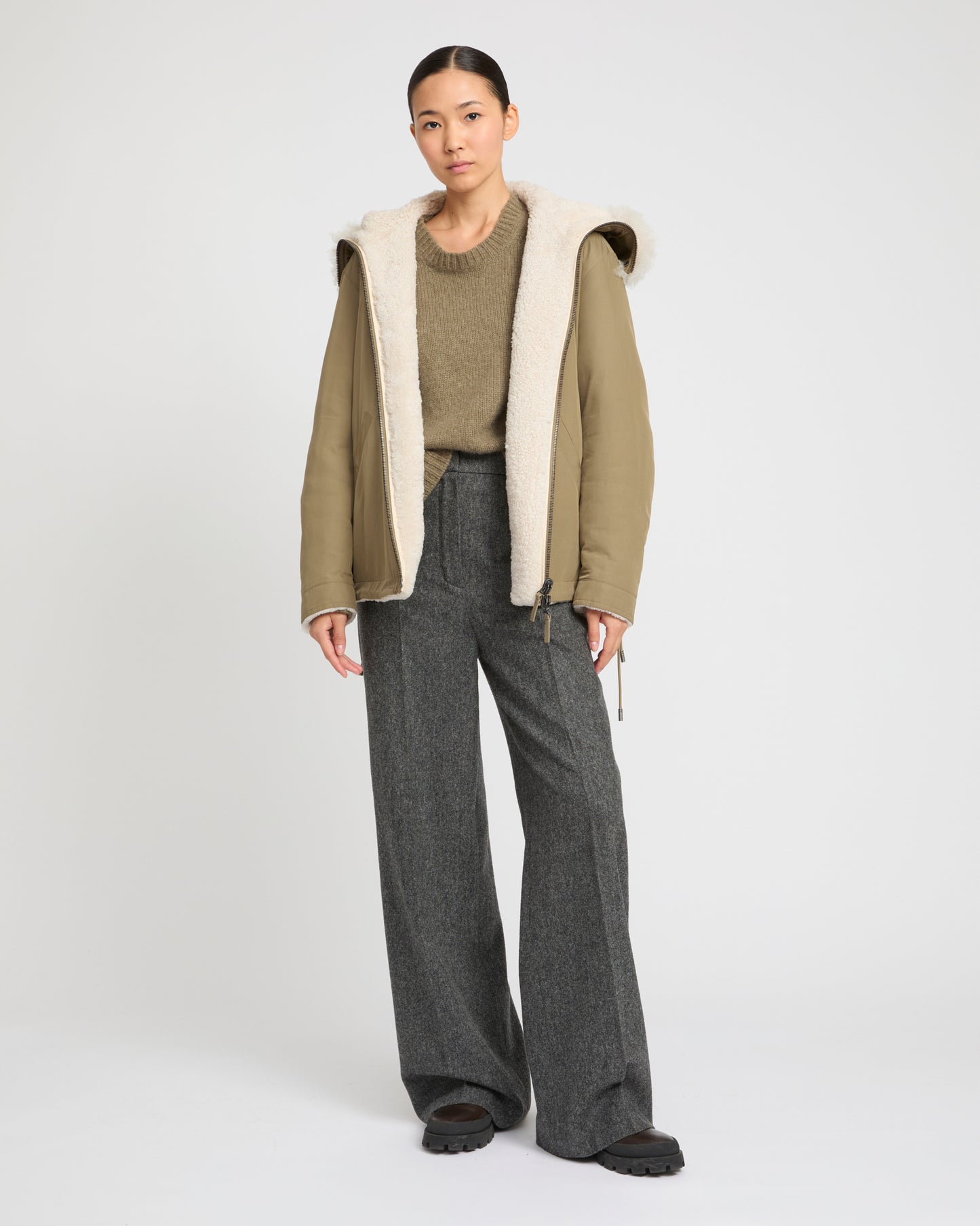 Revrsible hooded jacket in lambskin shearling and technical fabric