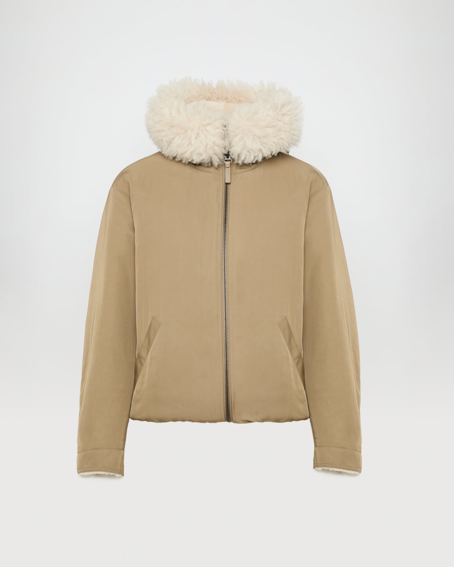 Revrsible hooded jacket in lambskin shearling and technical fabric