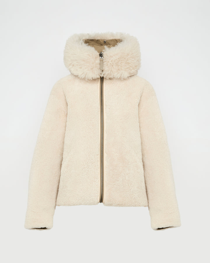 Revrsible hooded jacket in lambskin shearling and technical fabric