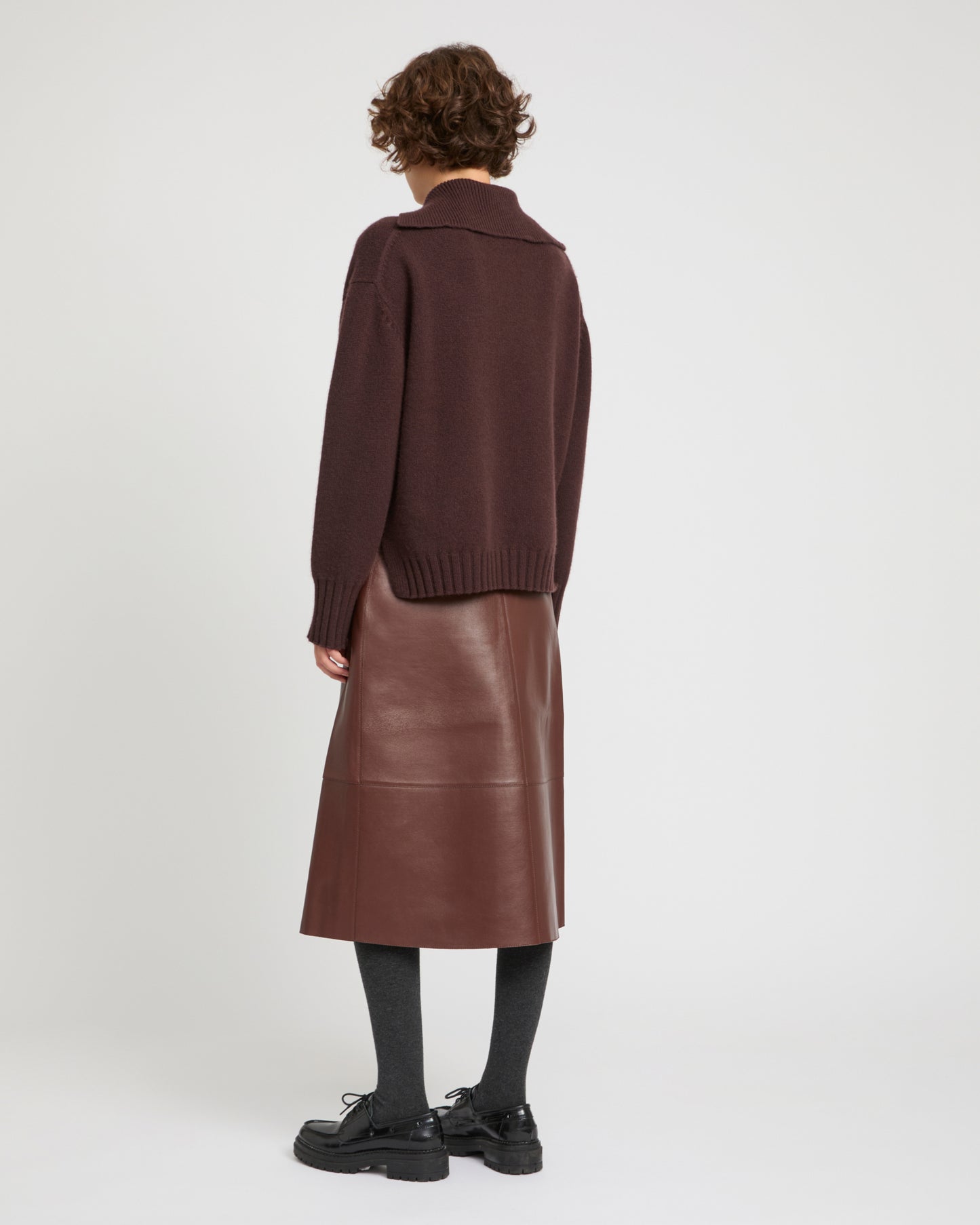 Jupe porte-feuille en cuir d'agneau doublé tissu motif pied-de-poule