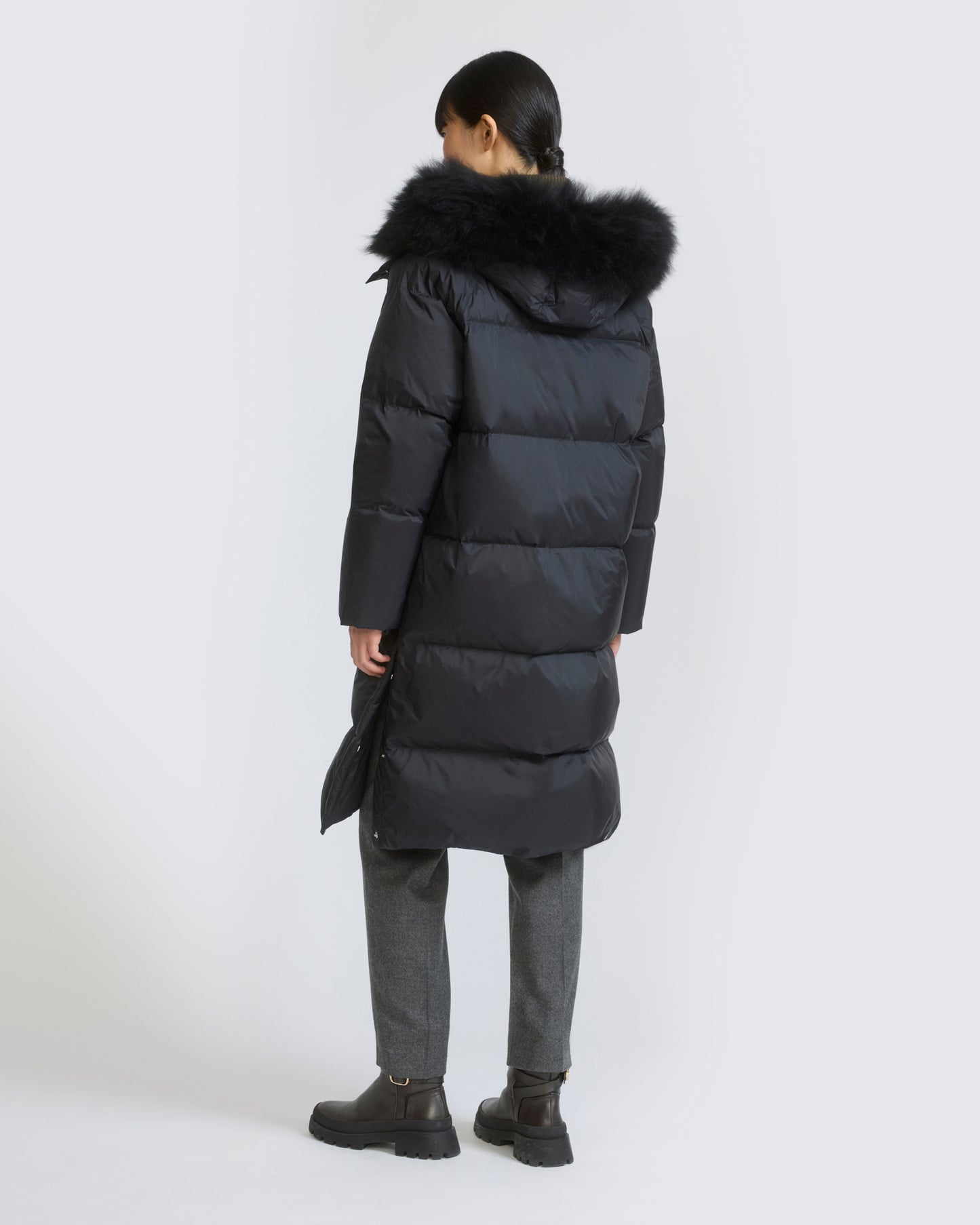 Long down jacket in waterproof technical fabric with airy lamb wool trim