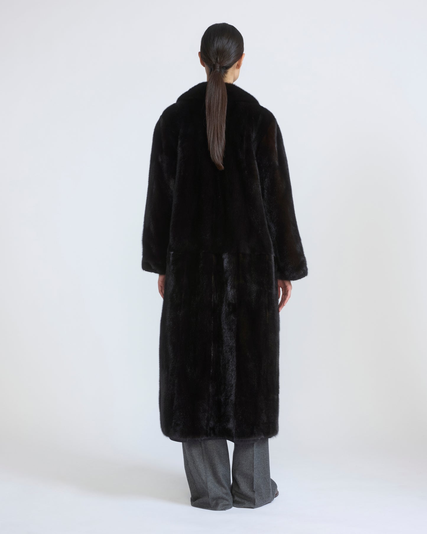 Long reversible coat in water-repellent technical fabric and mink fur