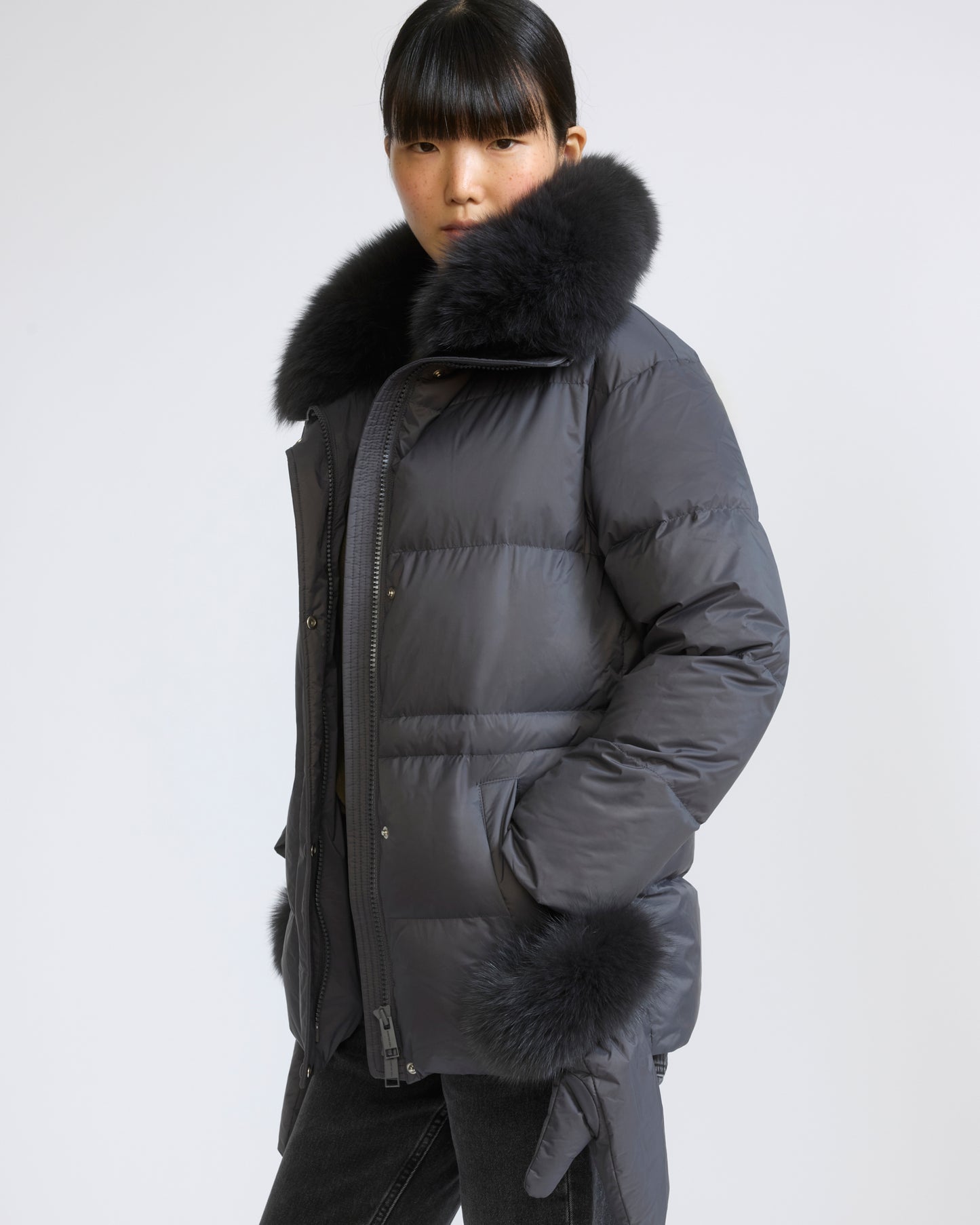 Down jacket in waterproof technical fabric with mittens and fox fur trim