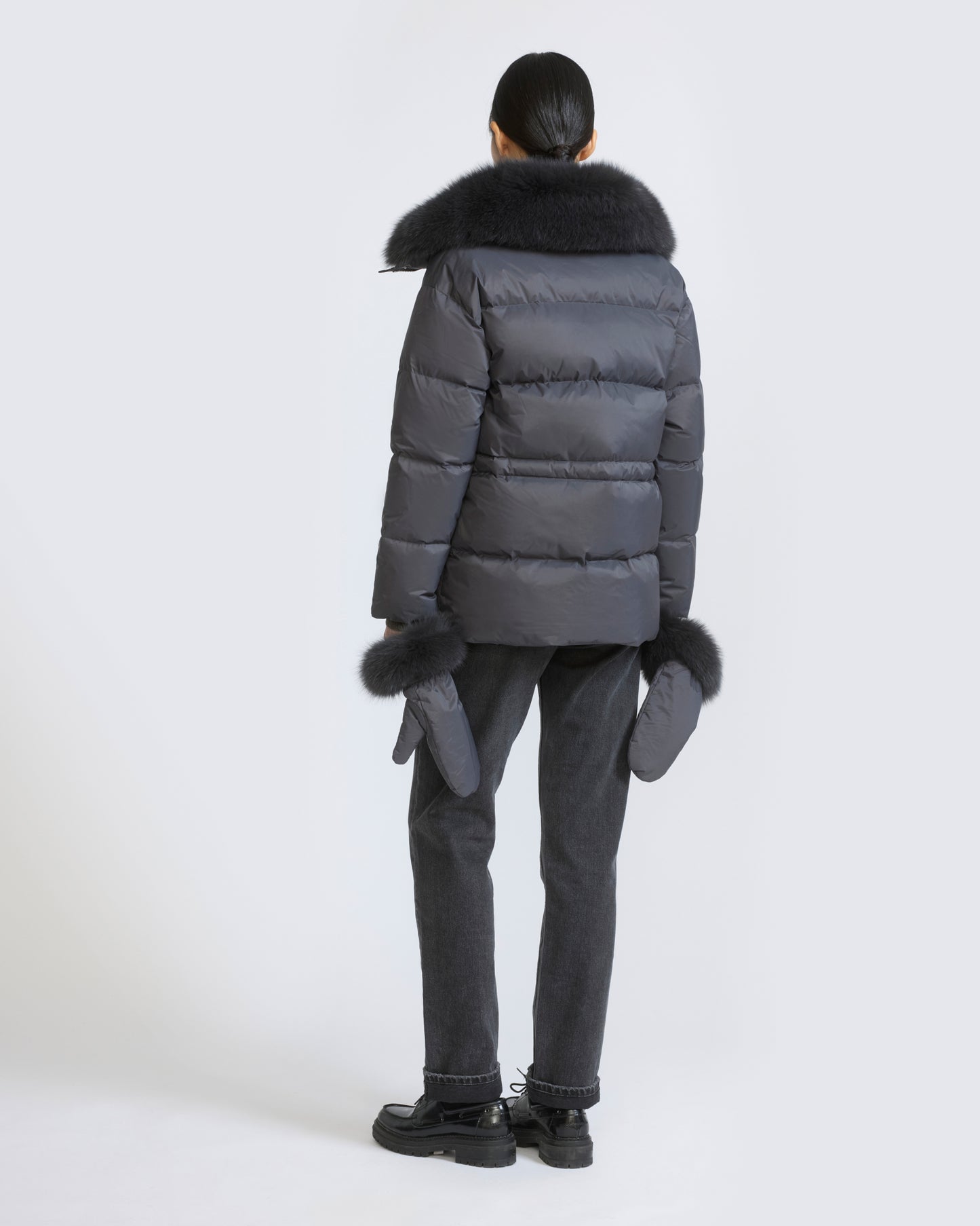 Down jacket in waterproof technical fabric with mittens and fox fur trim