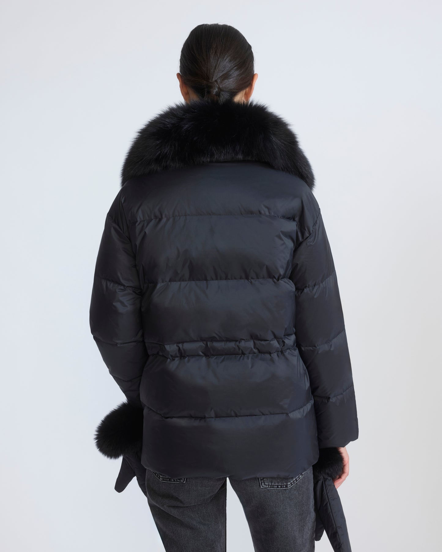 Down jacket in waterproof technical fabric with mittens and fox fur trim