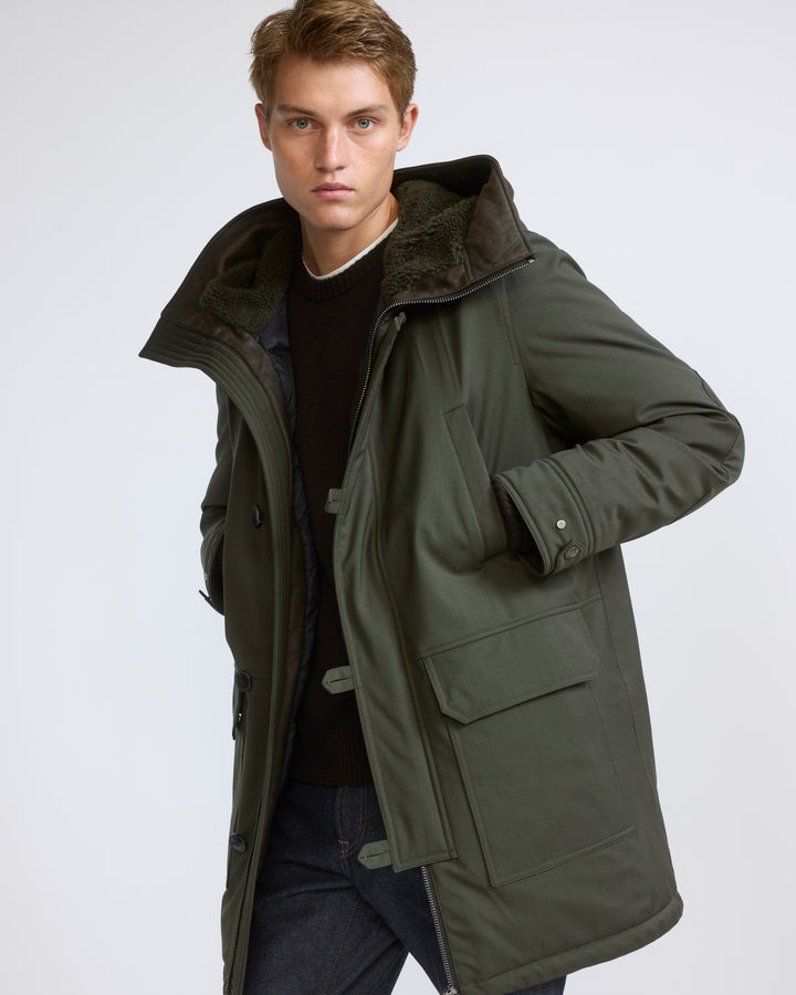 Parka longue en tissu technique laine mélangée waterproof et peau lainée d'agneau