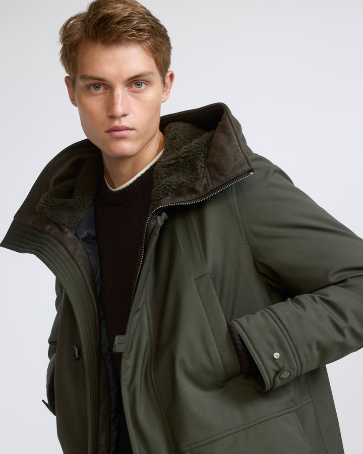 Parka longue en tissu technique laine mélangée waterproof et peau lainée d'agneau