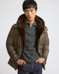 Down jacket in flannel waterproof technical fabric with mink fur bib panel