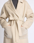 Manteau long en lainage cachemire double face et poches en fourrure de vison
