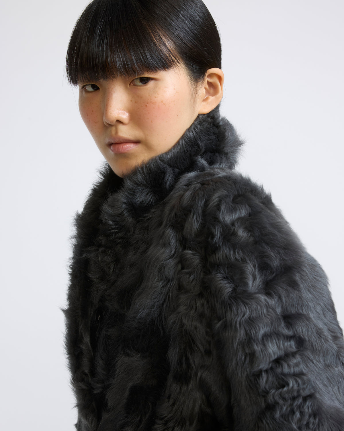 Manteau en agneau frisé