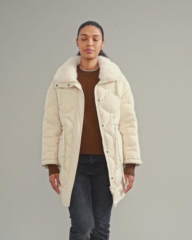 Down-filled coat in water-repellent technical fabric with short-haired lambskin collar trim