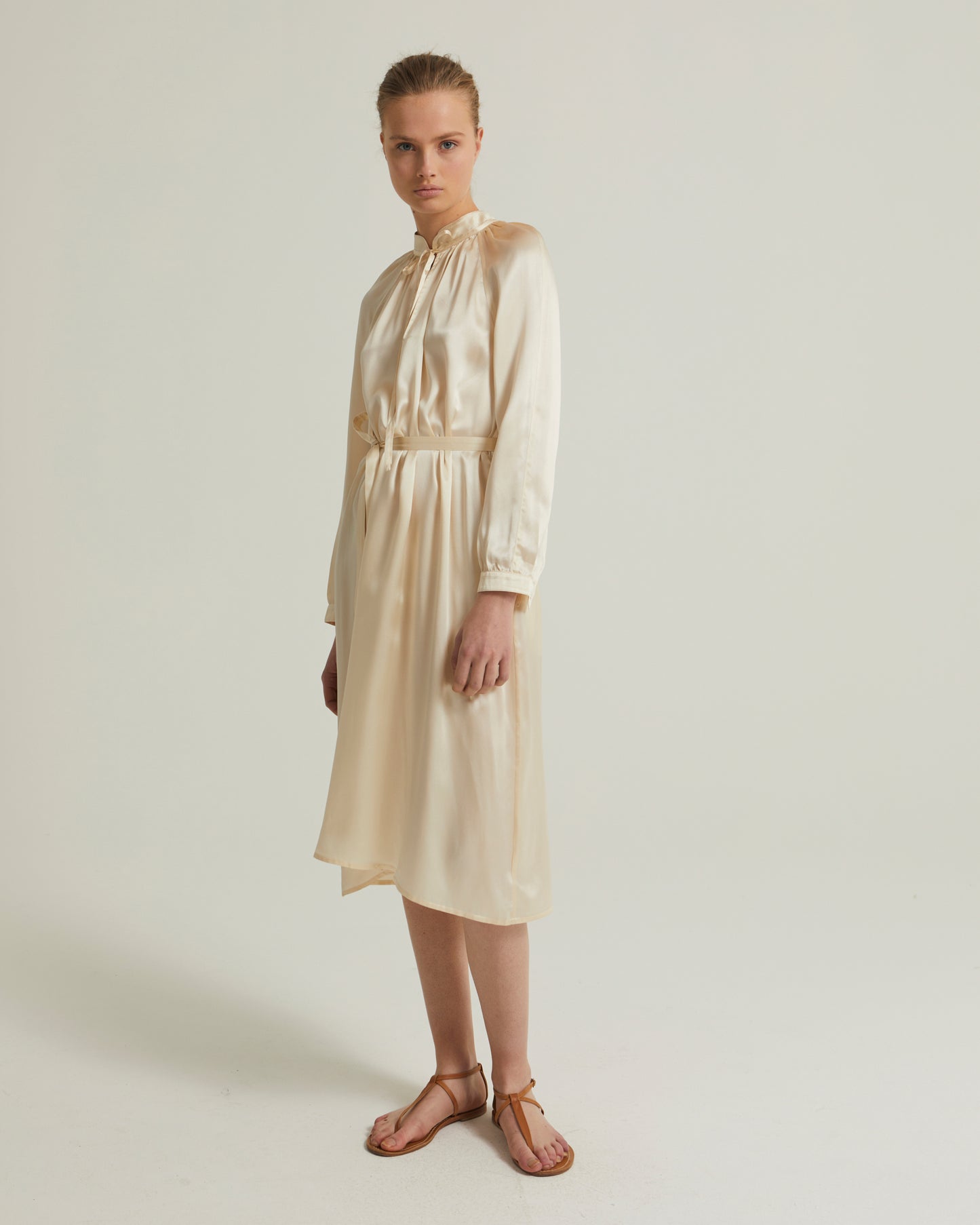 Flowing dress with long sleeves in silk satin